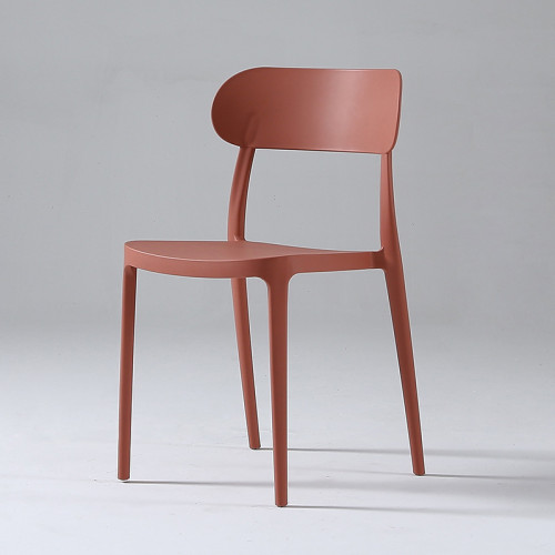 Red stackable plastic chair armless