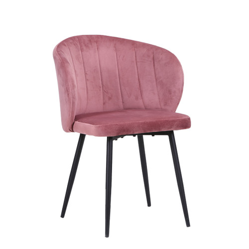 Pink velvet dining chair with sleek metal legs and a beautifully curved back