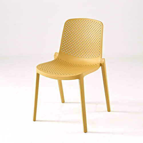 Yellow plastic dining chair hollow out
