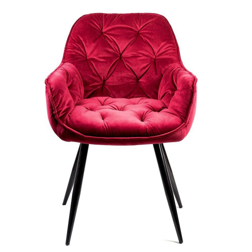 Red tufted velvet chair with metal legs and armrest