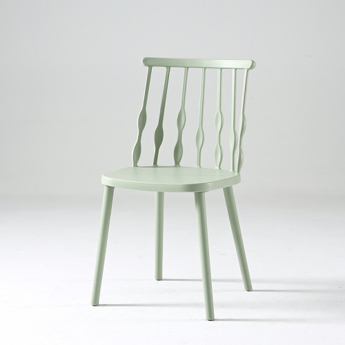 Light green armless plastic windsor chair