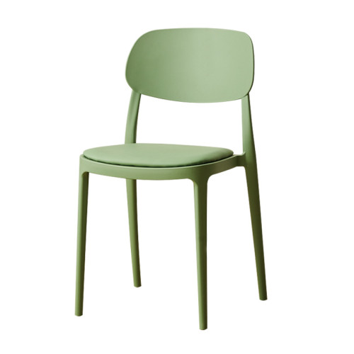 Comfortable green plastic chair with faux leather cushion