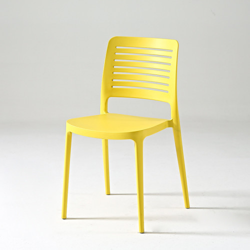 Hollow out curved back yellow plastic chair stackable
