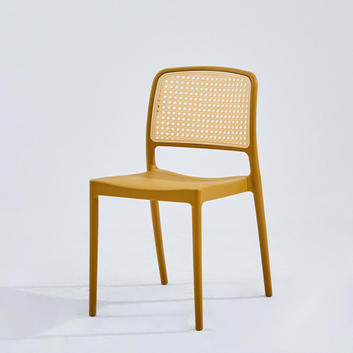 Stylish hollow out plastic rattan back chair yellow