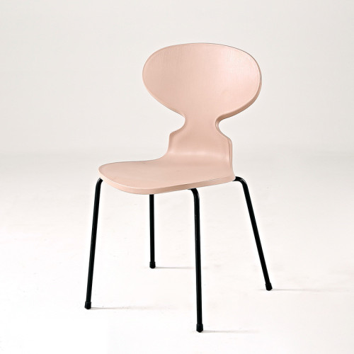 Pink plastic ant chair with black metal legs