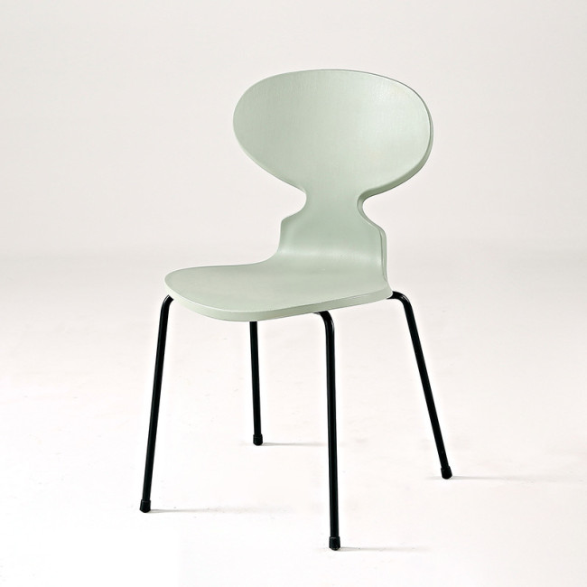 Light green plastic ant chair with black metal legs