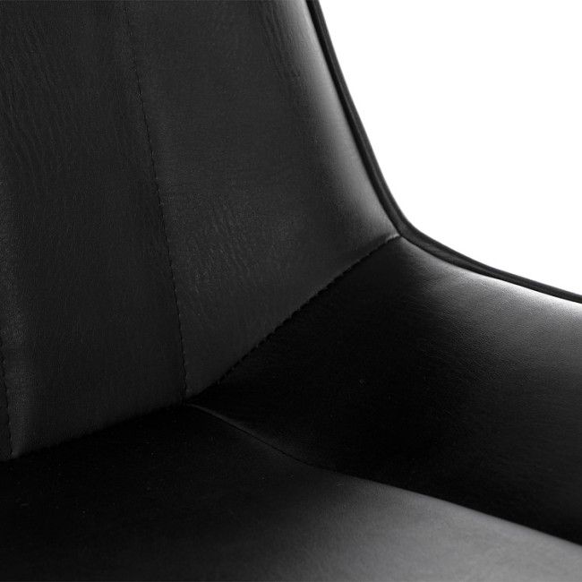 Sleek and stylish black faux leather dining chair with metal legs