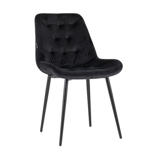 Black velvet tufted dining chair with a curved back and sleek metal legs
