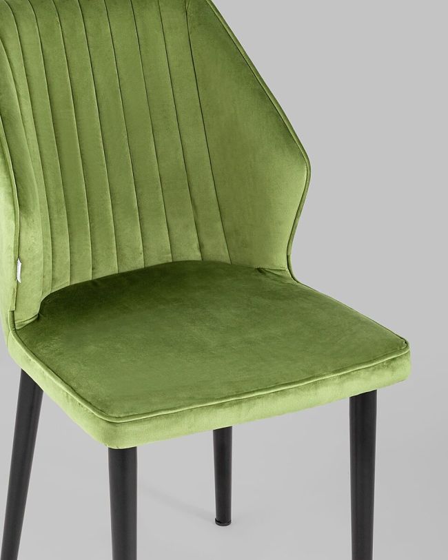 Curved back green velvet dining chair with metal legs