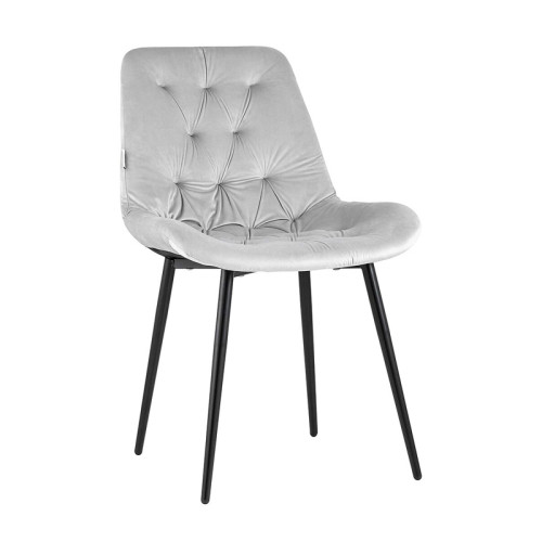 Light grey velvet tufted dining chair with a curved back and sleek metal legs