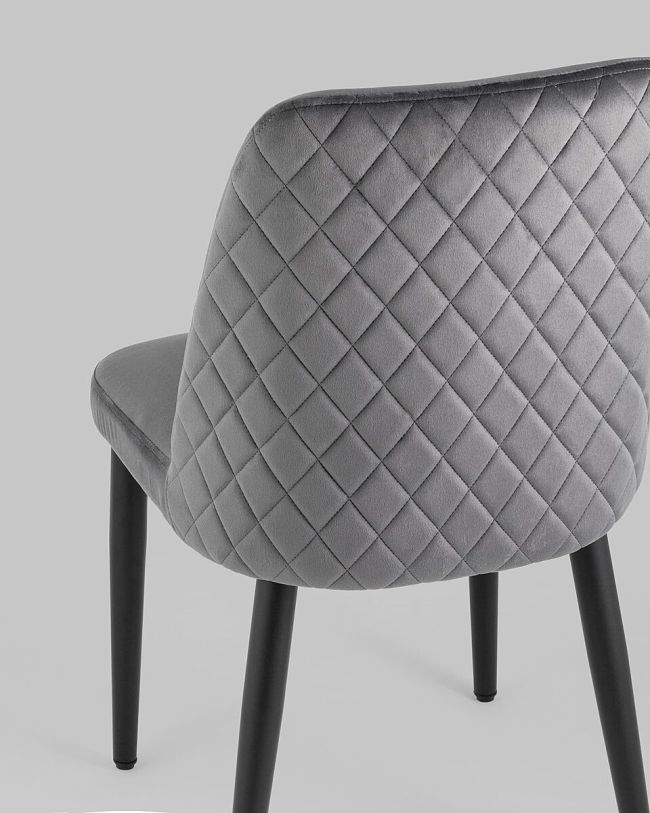 Stylish and elegant dark grey tufted velvet dining chair with metal legs