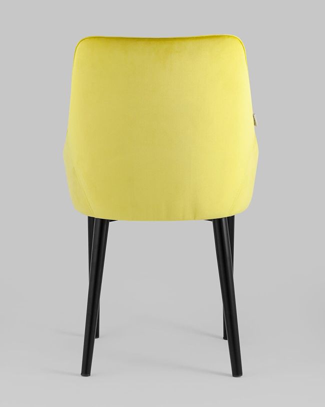 Curved back yellow velvet dining chair with armrest