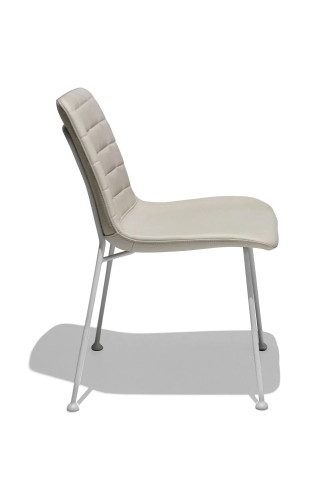 Beige faux leather dining chair with metal feet