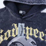 Bold hoodie featuring a futuristic robot head and  Godspeed  print. Back displays  OUT OF MANY, ONE  in distressed yellow text. Available in black and red with vintage wash. Perfect for edgy streetwear lovers.