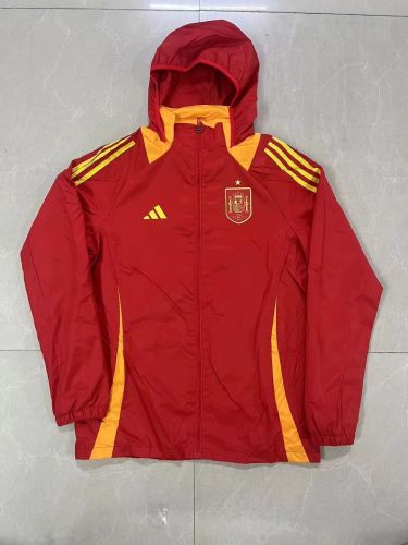 Spain with yellow windbreaker jacket with cpas
