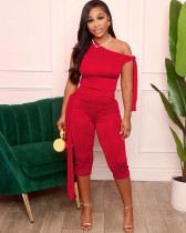 Sleeveless top with slash shoulder and slim-fitting shorts set