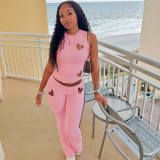 Fashion women's solid color heart hollow out sleeveless top and trousers set