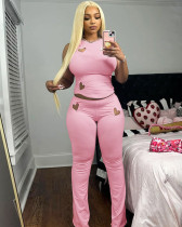 Fashion women's solid color heart hollow out sleeveless top and trousers set