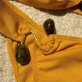 Sexy hollow out beads solid color ribbed split swimsuit bikini