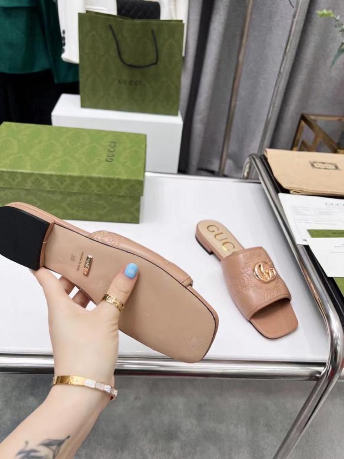 Gucci leather print slides Brown