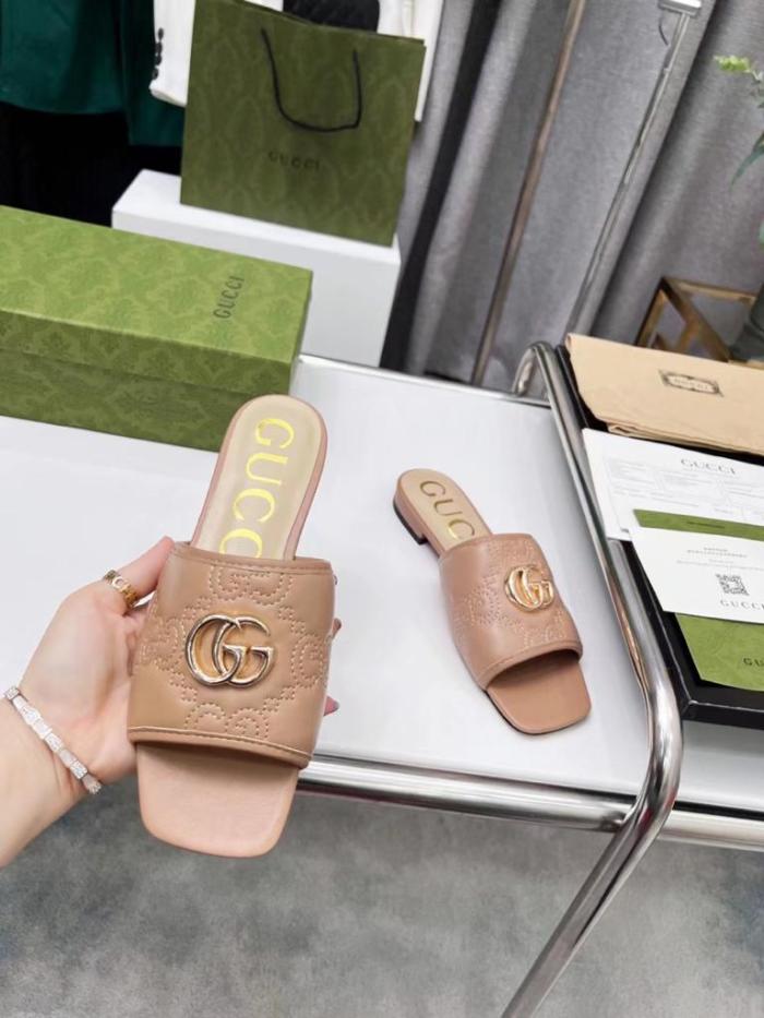 Gucci leather print slides Brown