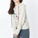 Katie Ermilio  Fashionable and cute rainbow sweater