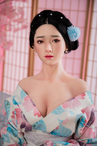 Slightly shy young adult Japanese native style kimono woman