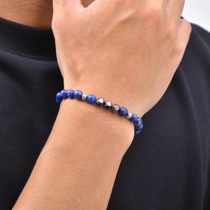 Man wearing a blue and black beaded bracelet